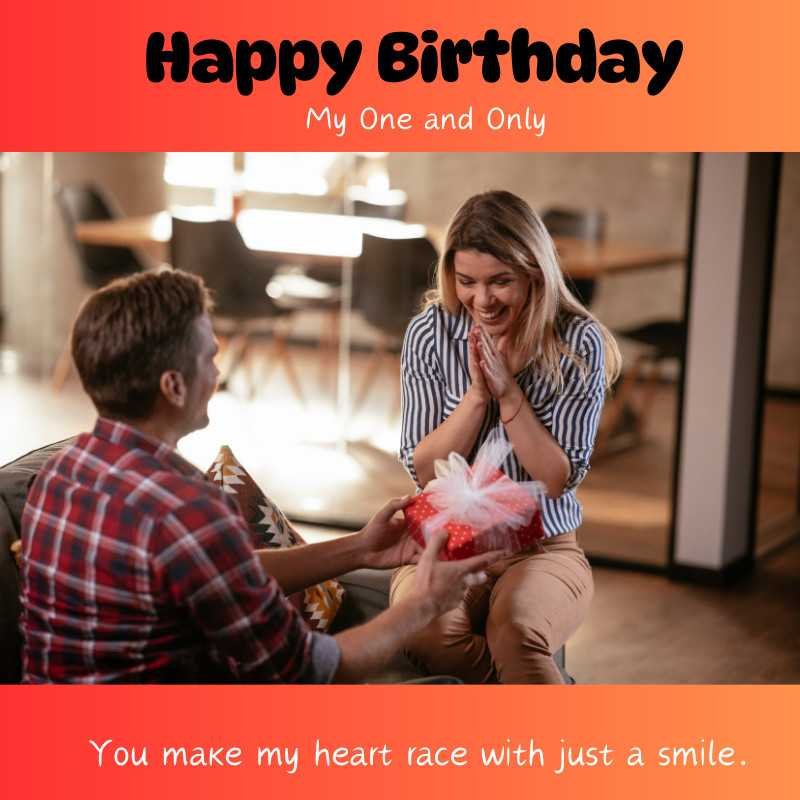 Man surprising woman with a birthday gift as she smiles joyfully.