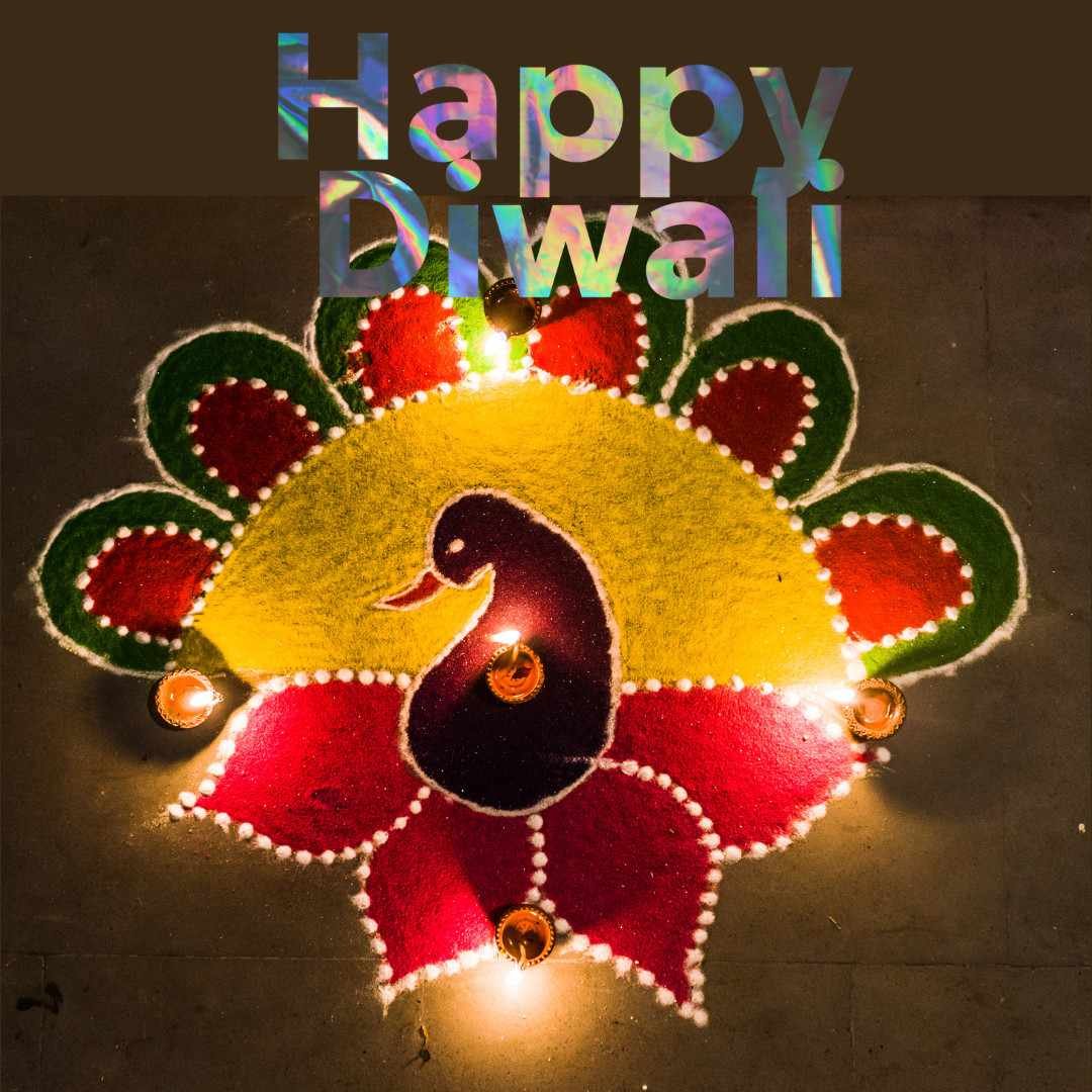 Colorful Diwali rangoli with candles and peacock motif