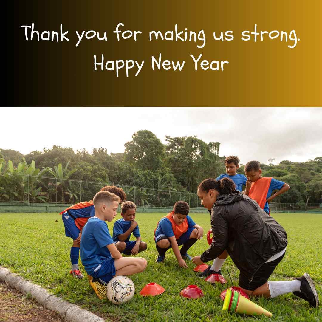 Coach training young soccer players on New Year