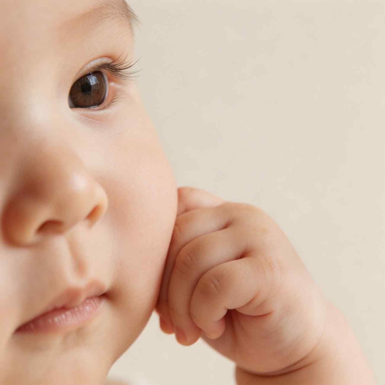 Minimal baby girl hand on cheek profile pic