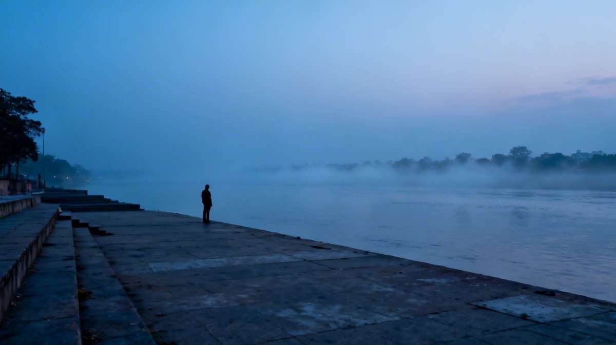 Lonely silhouette at Kolkata ghat — broken heart emotion