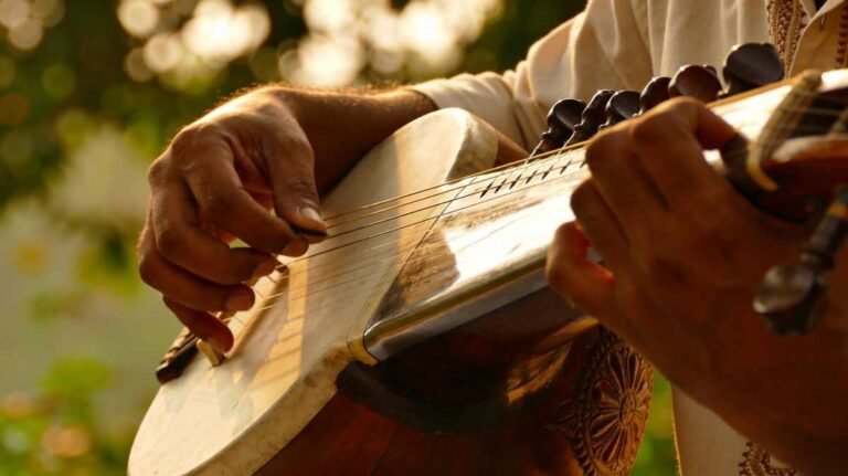 Musician playing soft Assamese melody on traditional instrument