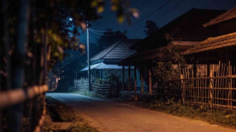 Empty village road at night showing loneliness and memories