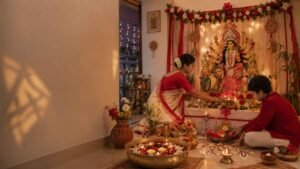 Durga Puja Decoration Ideas with flowers, diyas, fairy lights and an elegant Bengali home altar