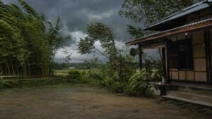 Bordoisila Assamese Poem represented by a spring storm approaching an Assamese village with bamboo groves and traditional homes.